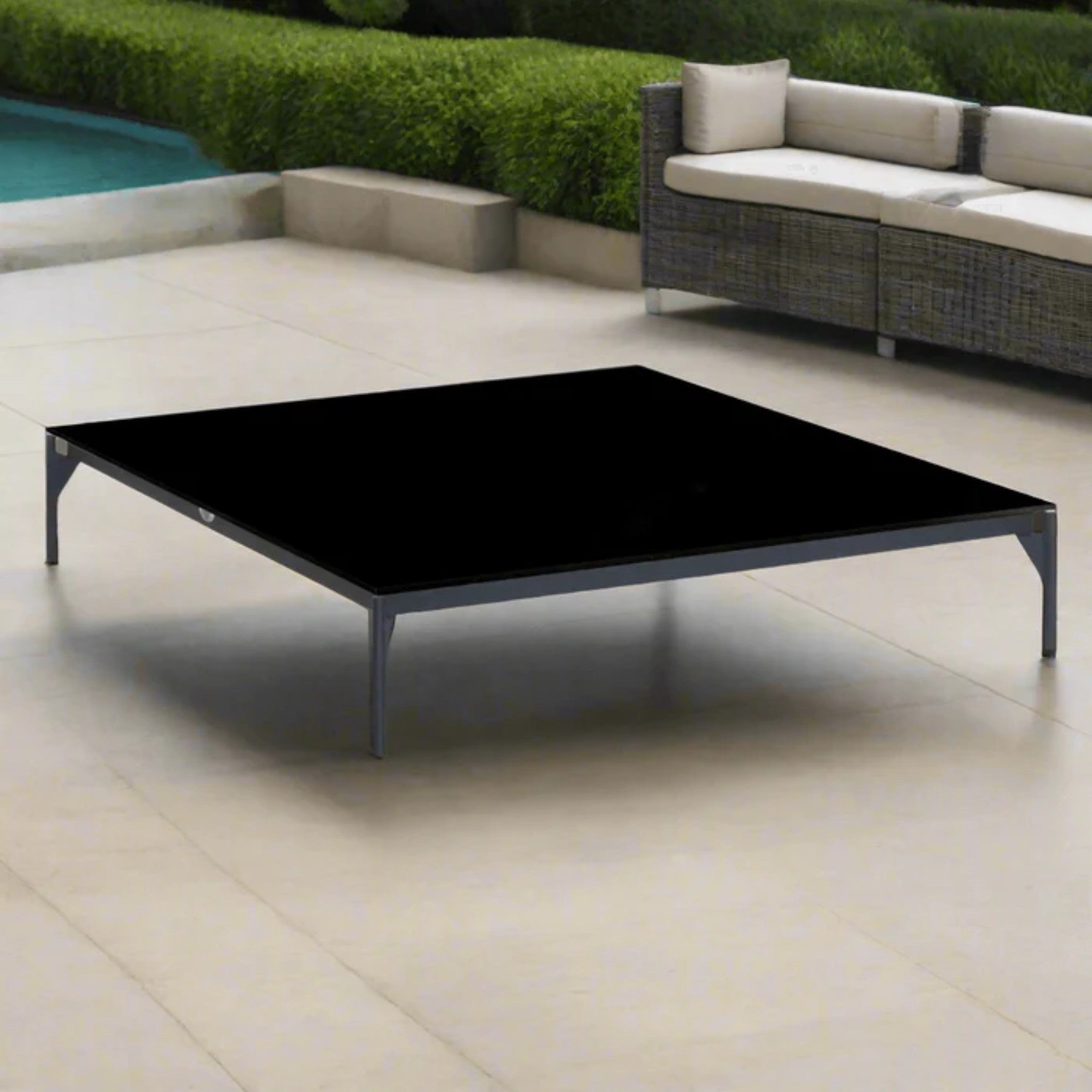 Skyline Design Boston outdoor lounge set with sofa, chairs, and tables, featuring modern outdoor furniture on a patio.