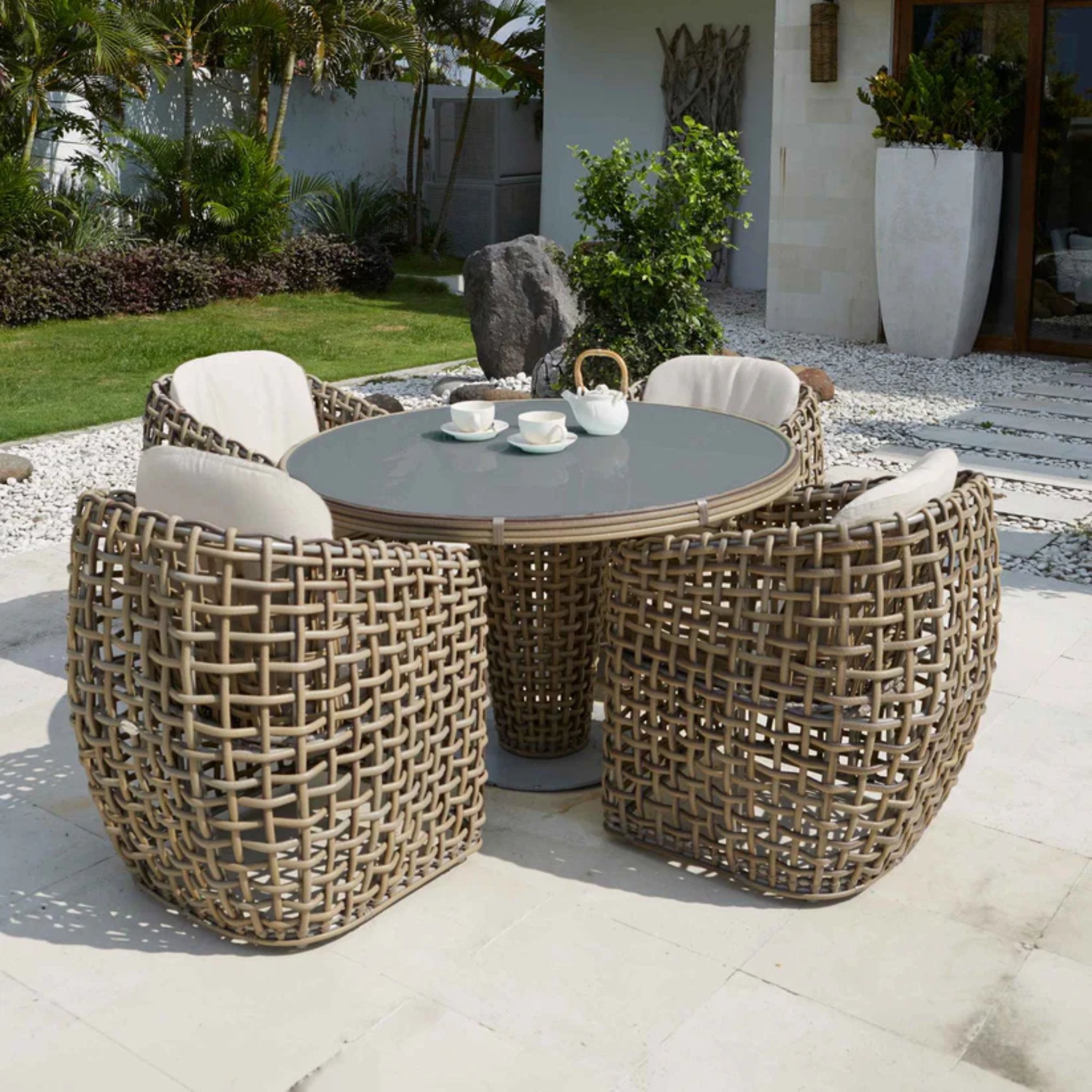 Skyline Design Dynasty 5-piece outdoor dining set with round table and four chairs, stylish and durable for outdoor patio use.