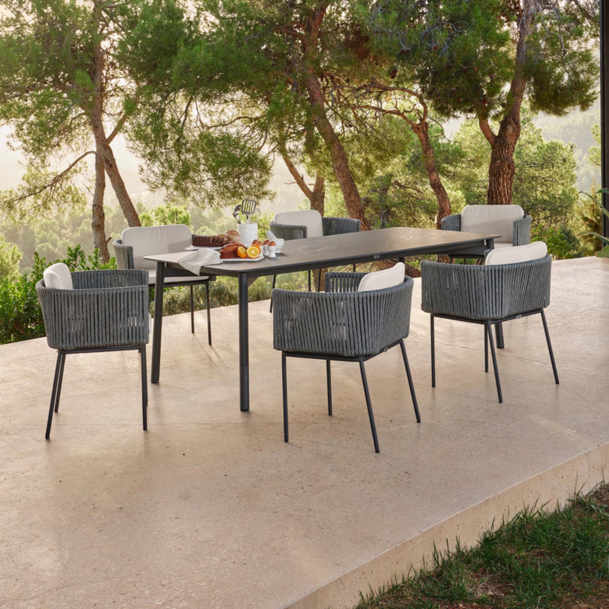 Skyline Design Boston outdoor 7-piece rectangular dining set with table and six matching chairs, perfect for outdoor dining spaces.