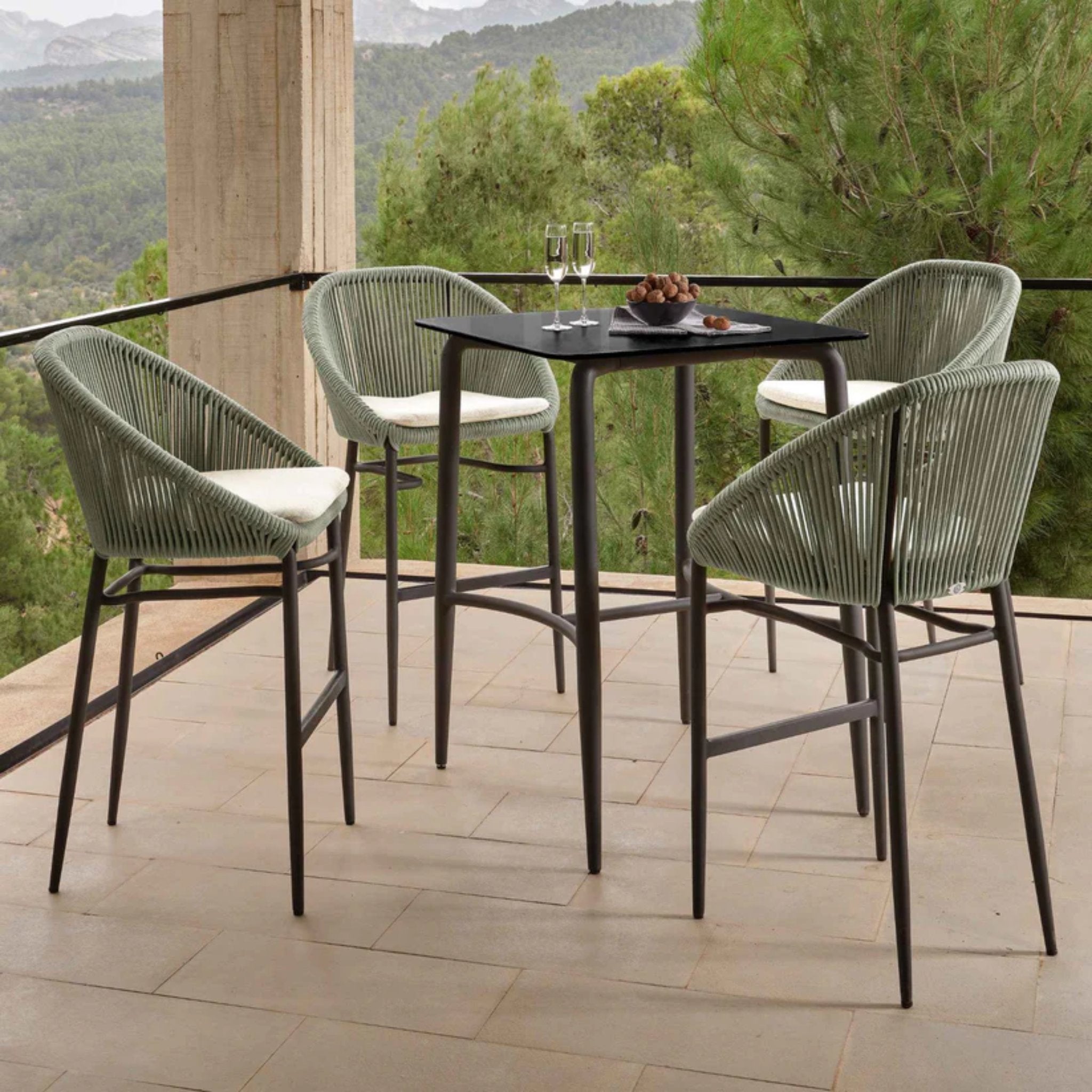 Skyline Design Rodona 5-piece outdoor bar set with pub table and four matching barstools, suitable for outdoor dining and entertaining.