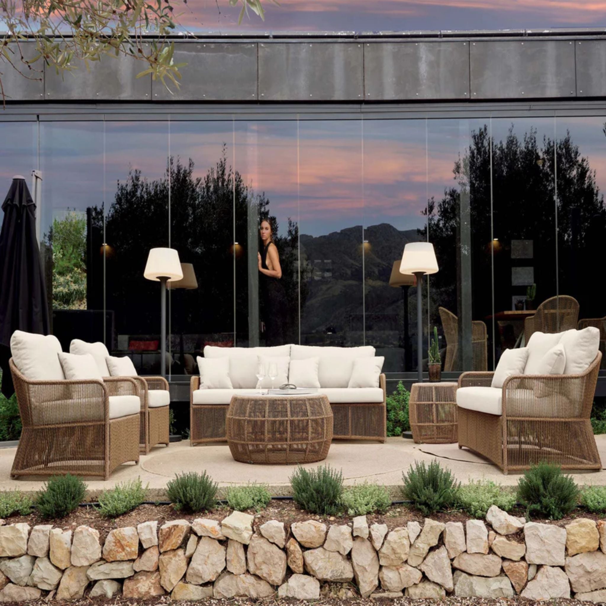 Skyline Design Calixto outdoor lounge set with sofa, chairs, and tables, featuring modern outdoor furniture in a stylish patio setting.