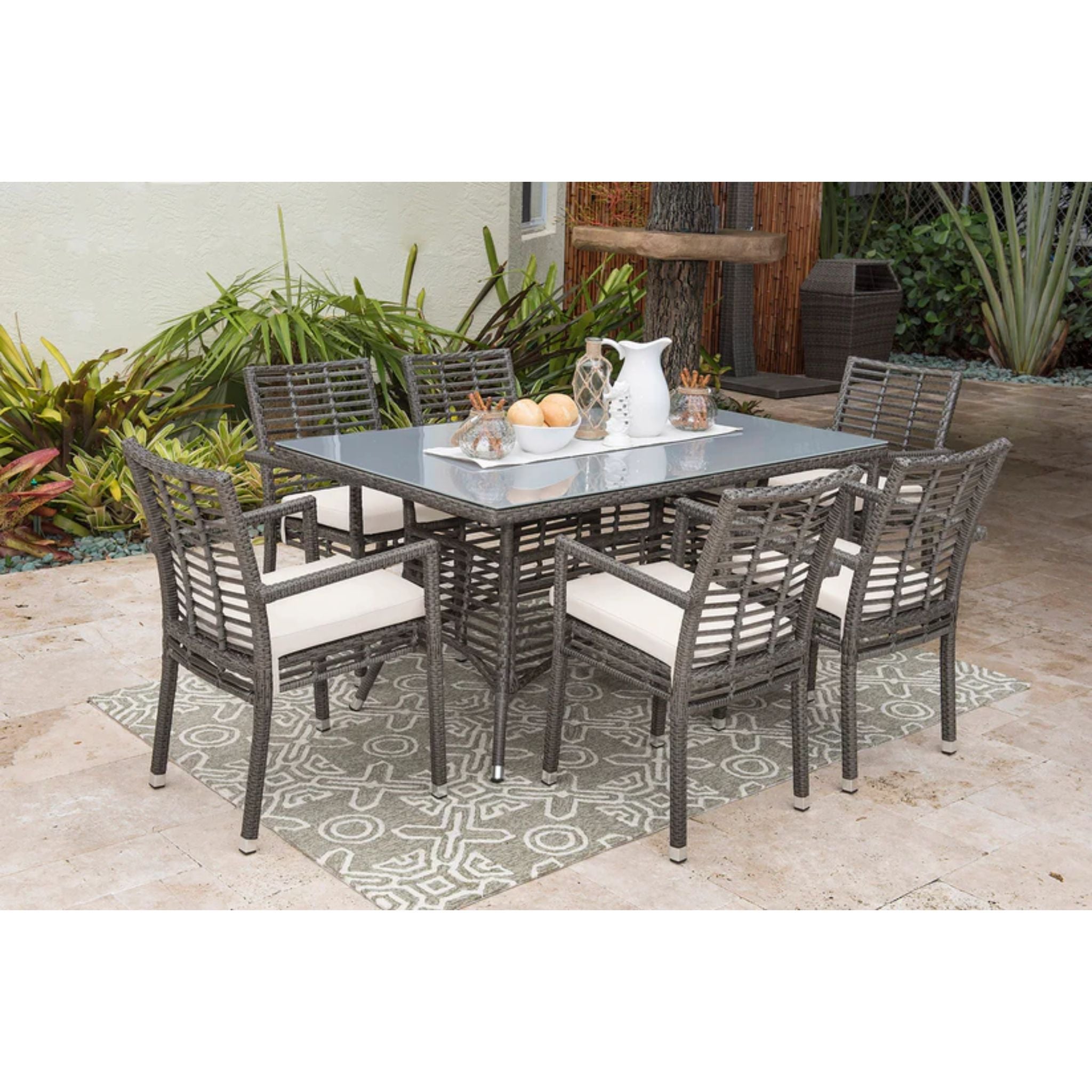 Panama Jack Outdoor Graphite 7-piece outdoor dining set with armchair chairs and cushions, ideal for patio or garden dining.