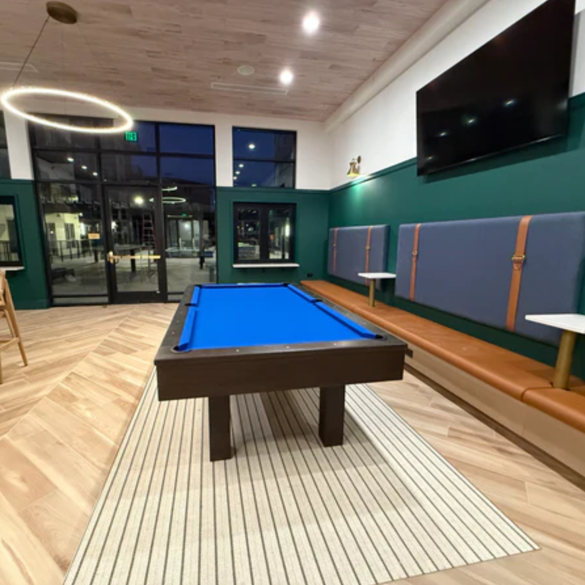 True North Legacy 8 ft solid hardwood pool table with espresso finish, navy blue felt, Italian slate, and classic billiards design.