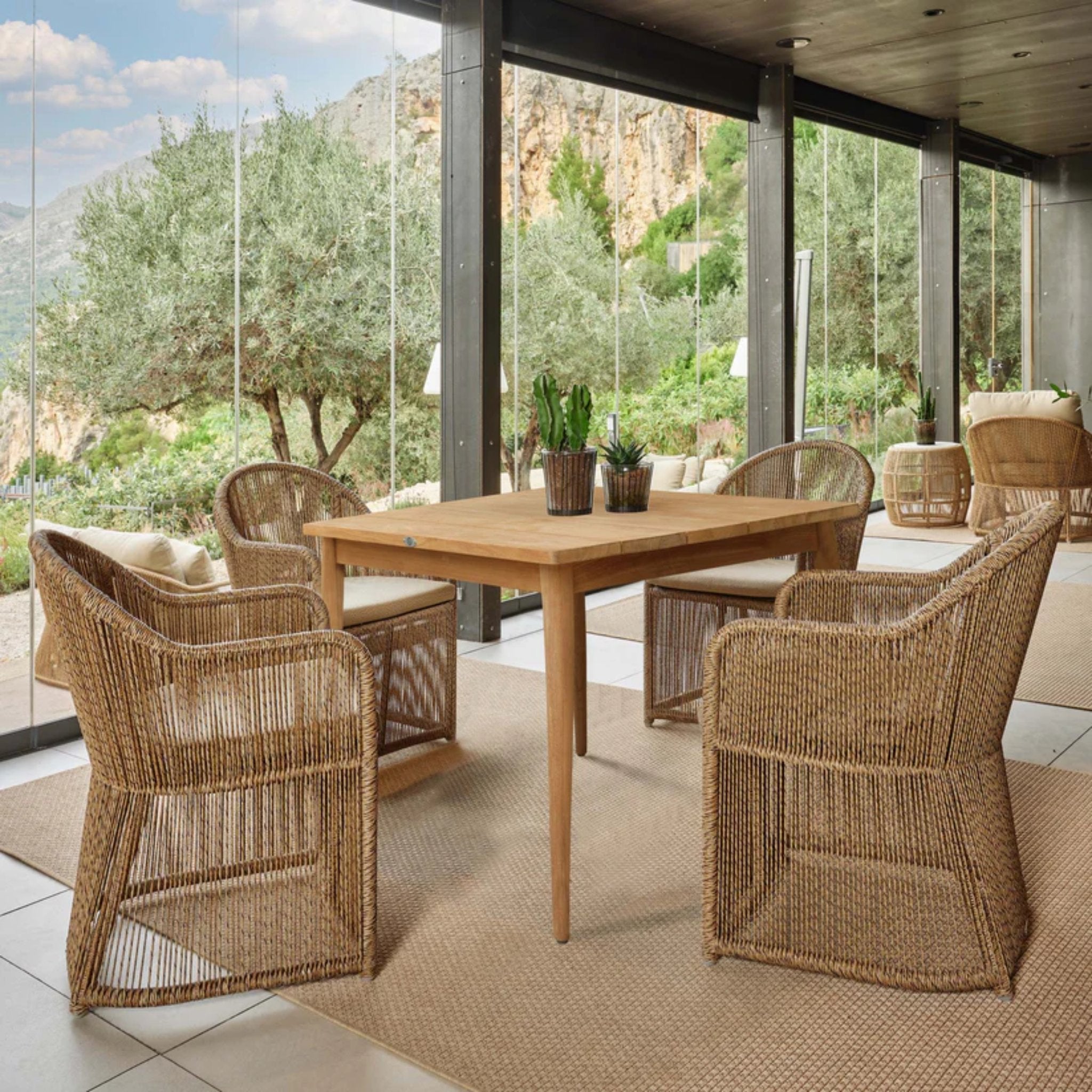 Skyline Design Calixto 5-piece outdoor square dining set with teak finish, includes square table and four matching chairs.