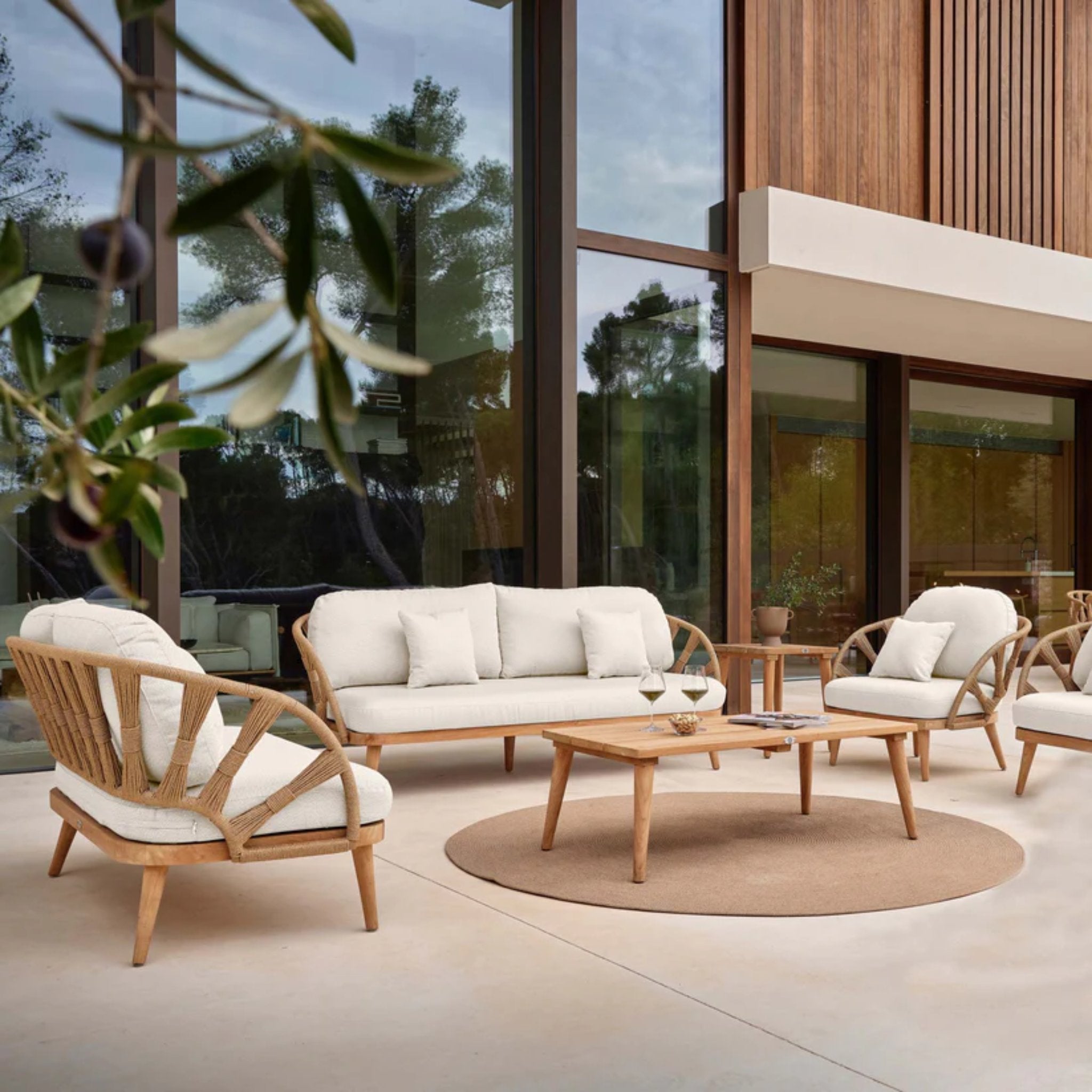 Skyline Design Krabi 7-piece outdoor lounge set with sofas, chairs, and tables, designed for stylish outdoor comfort.