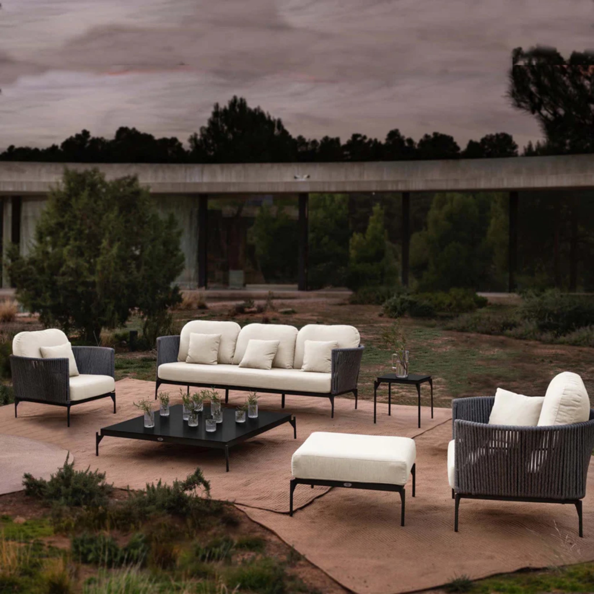 Skyline Design Boston 6-piece outdoor lounge set with sofa, chairs, and tables, featuring modern outdoor furniture in a stylish setup.