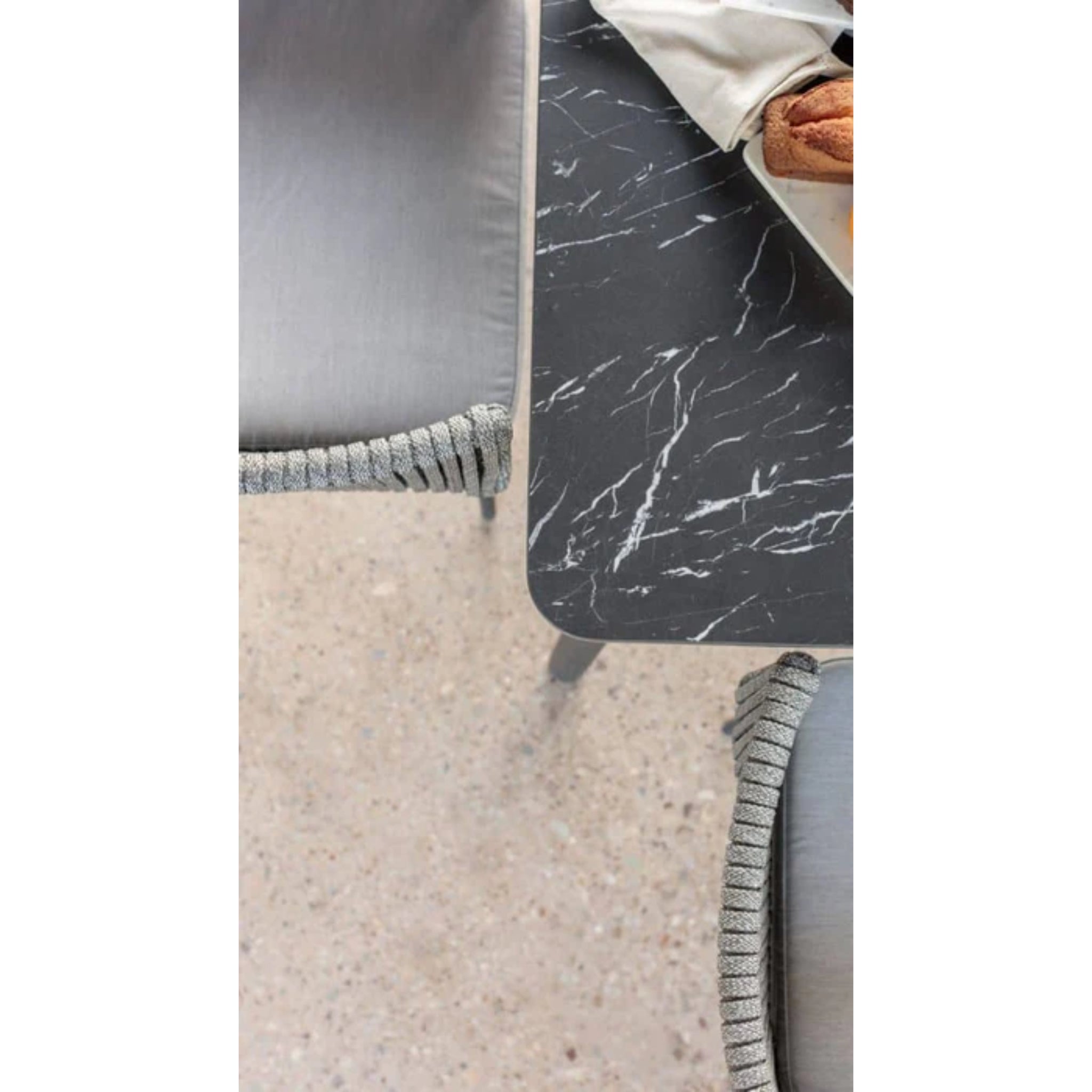 Skyline Design Boston outdoor 7-piece dining set with rectangular aluminum table and six matching chairs on a patio.