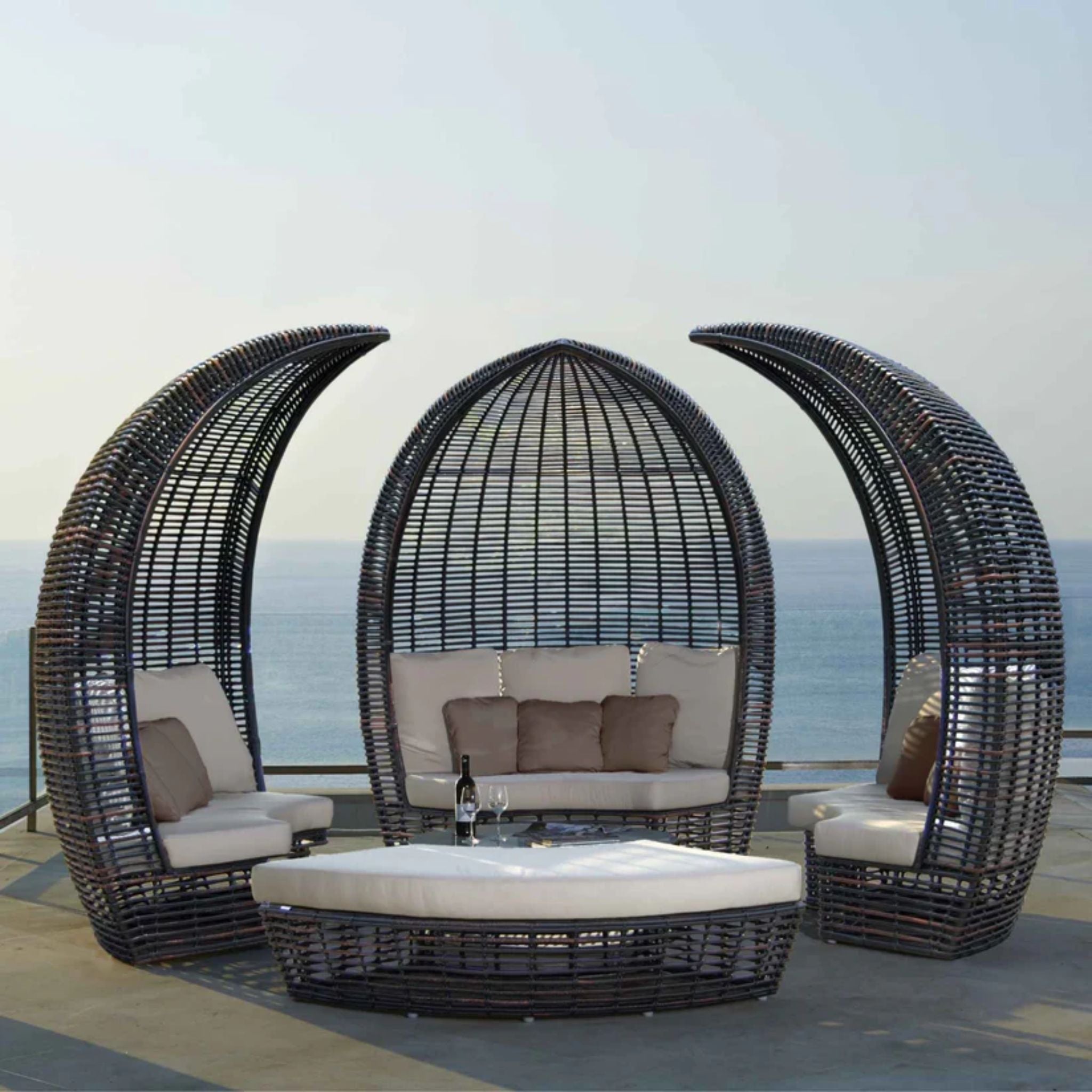 Skyline Design outdoor daybed set with cushions, featuring a stylish and comfortable lounge area with a metal frame and plush cushions.