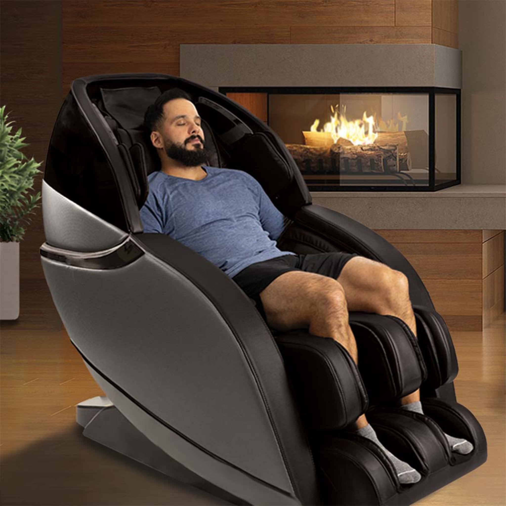Kyota Kansha M878 luxury black full body zero gravity massage chair with ergonomic design and padded armrests.