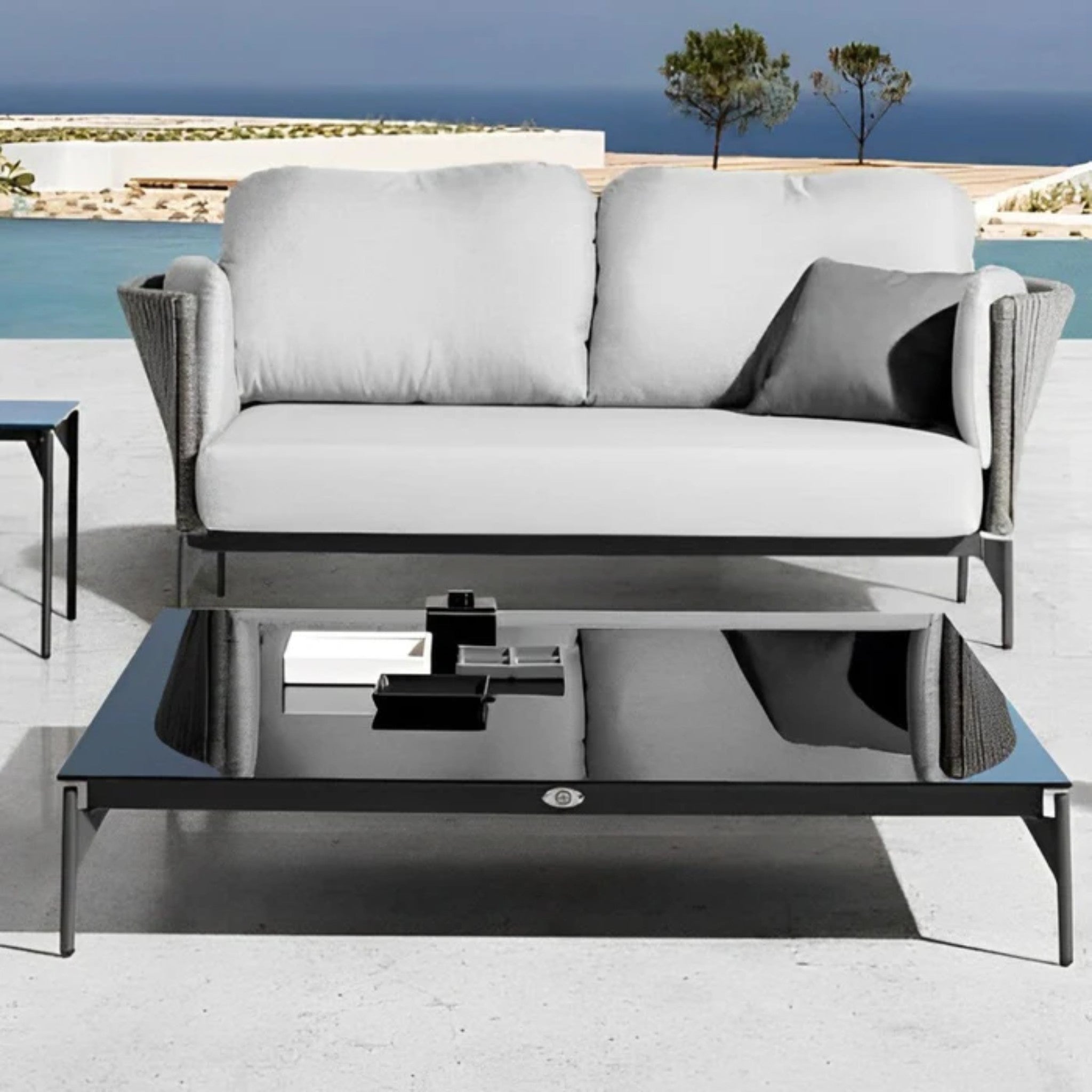 Skyline Design Boston outdoor lounge set with sofa, chairs, coffee tables, and glass tabletop for stylish outdoor relaxation.