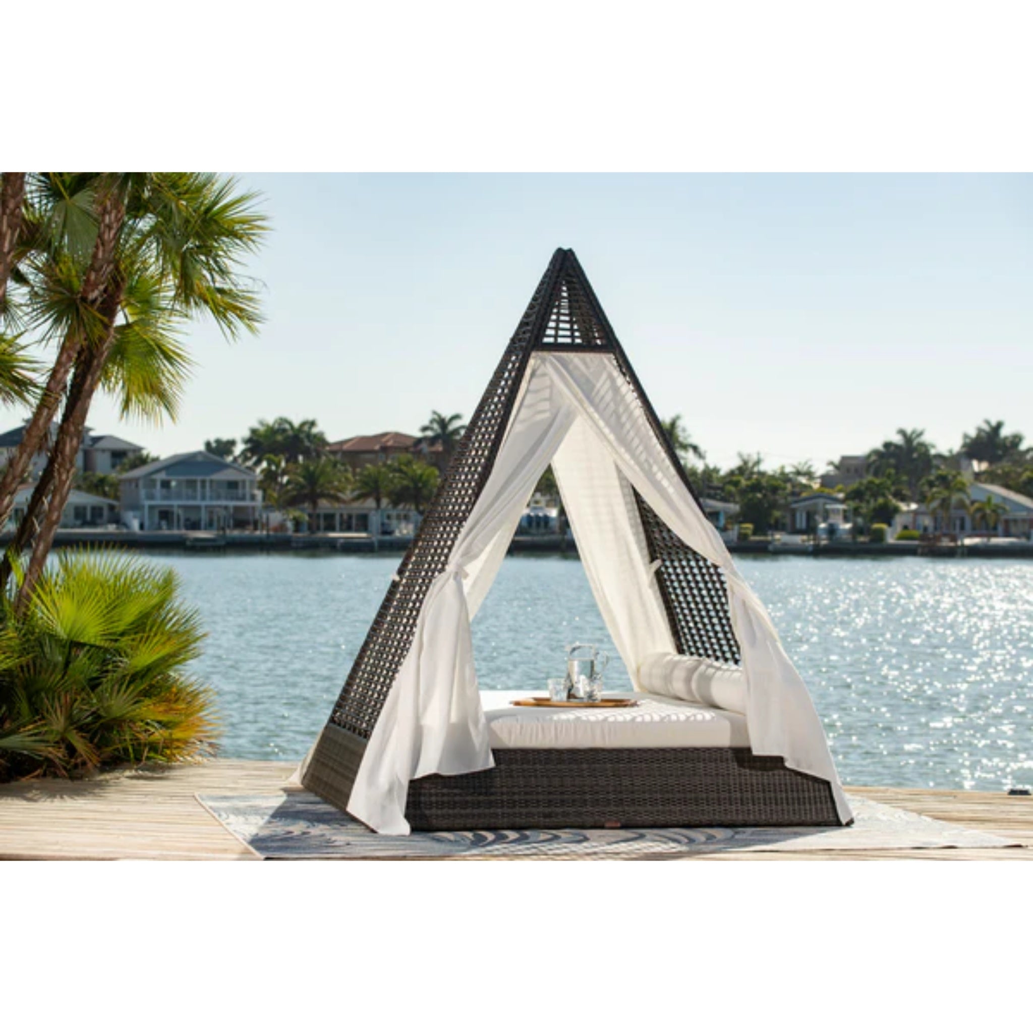 Panama Jack Outdoor Helios luxury wicker outdoor daybed with plush cushions for patio lounging and relaxation.