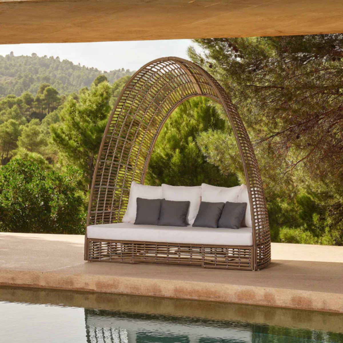 Skyline Design Ruby outdoor daybed with luxury woven fiber in mushroom finish, featuring plush cushions for patio lounging.