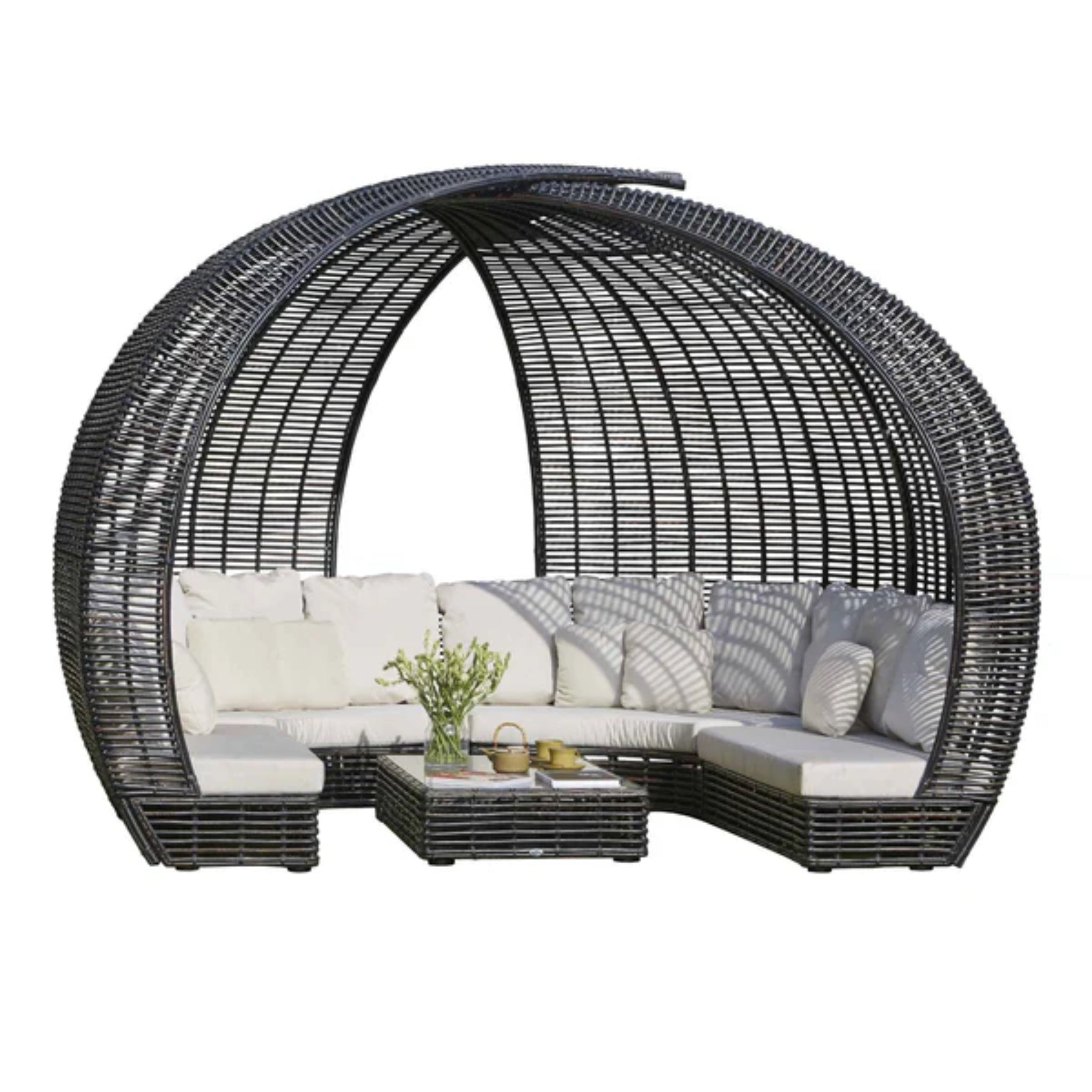Skyline Design Sparta outdoor daybed with woven fiber frame in mushroom finish, featuring plush cushions and a modern patio design.