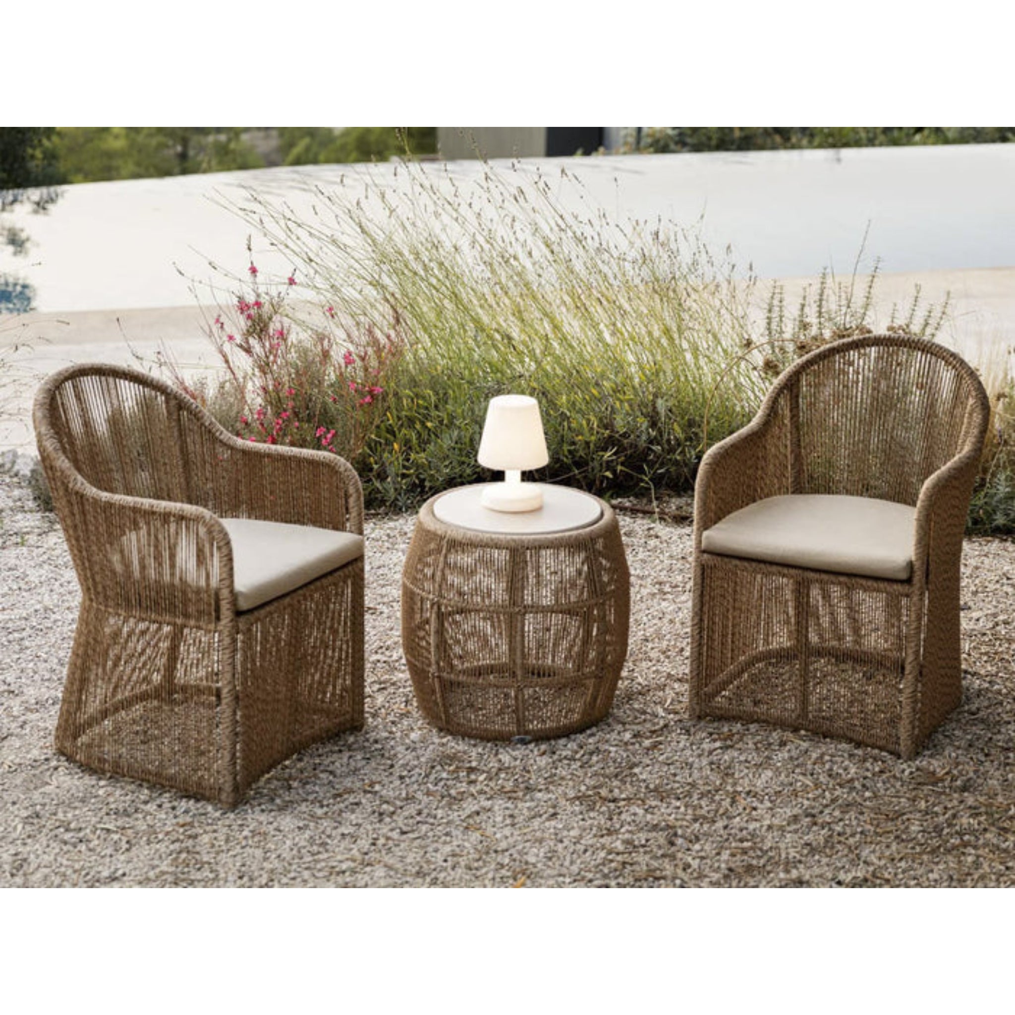 Skyline Design Calixto outdoor dining armchair with Nigerian Twist weave, featuring a stylish, comfortable design for outdoor dining.