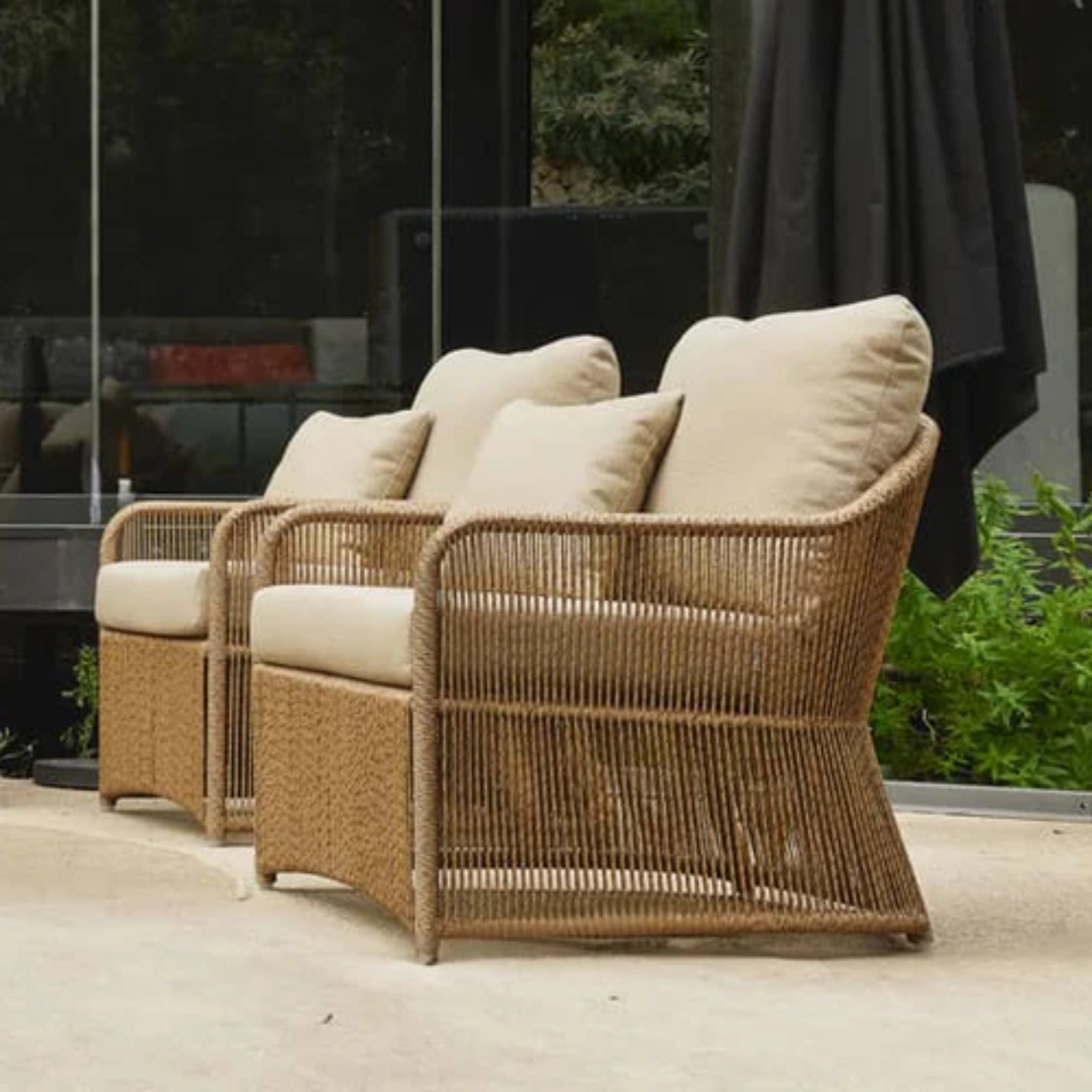 Skyline Design Calixto outdoor lounge chair with Nigerian twist weave, featuring a stylish patio armchair design for outdoor relaxation.