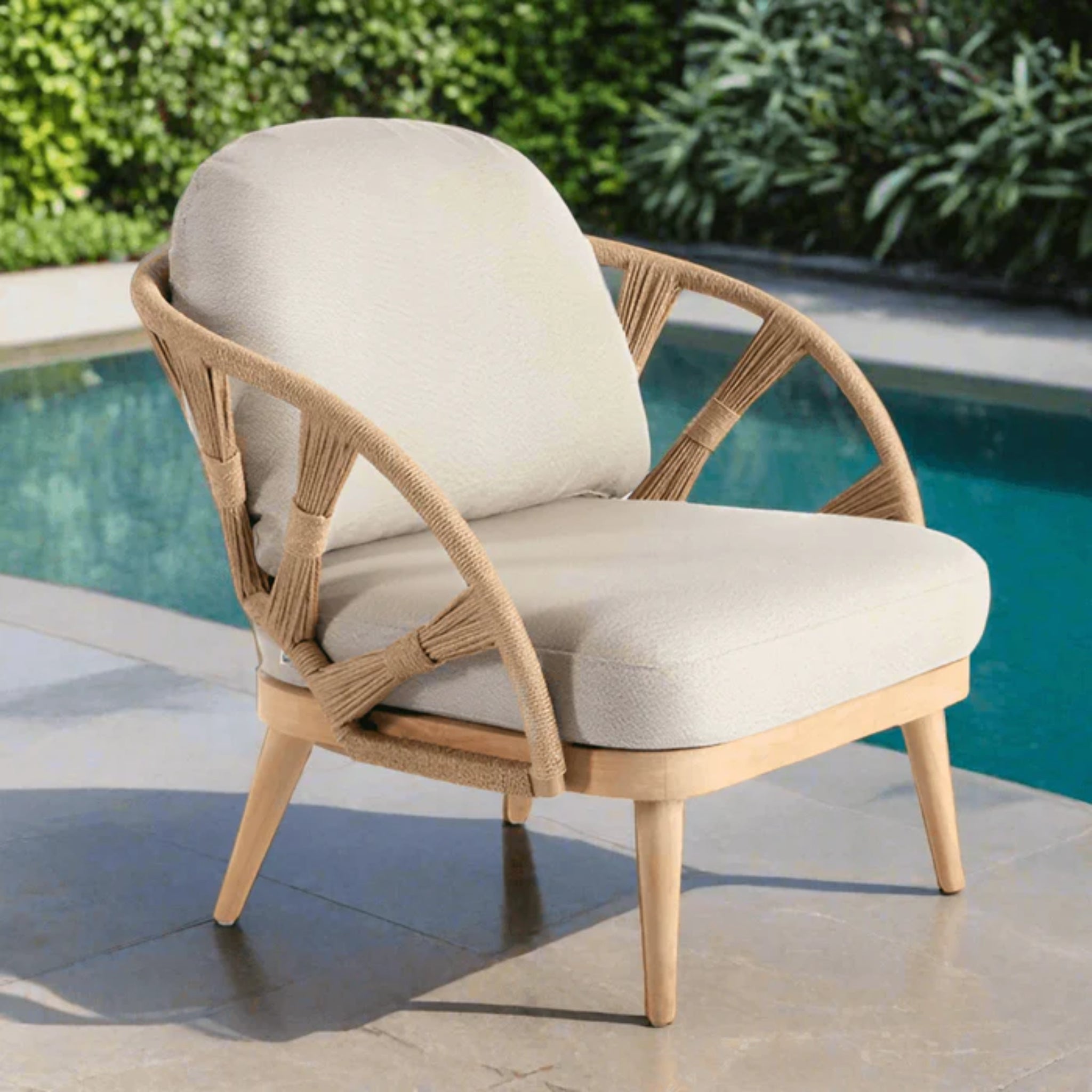 Skyline Design Krabi outdoor lounge chair with natural rope and teak frame, part of a 7-piece outdoor seating set with sofas and tables