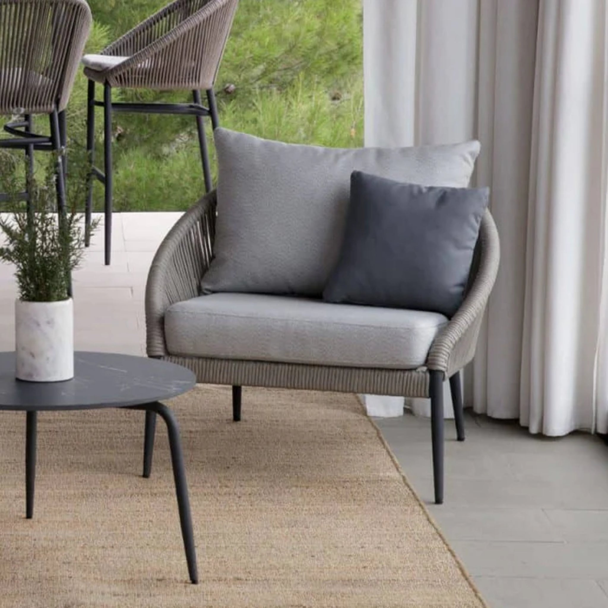 Skyline Design Rodona outdoor lounge chair with silver grey polyrope arms, stylish patio armchair for outdoor relaxation