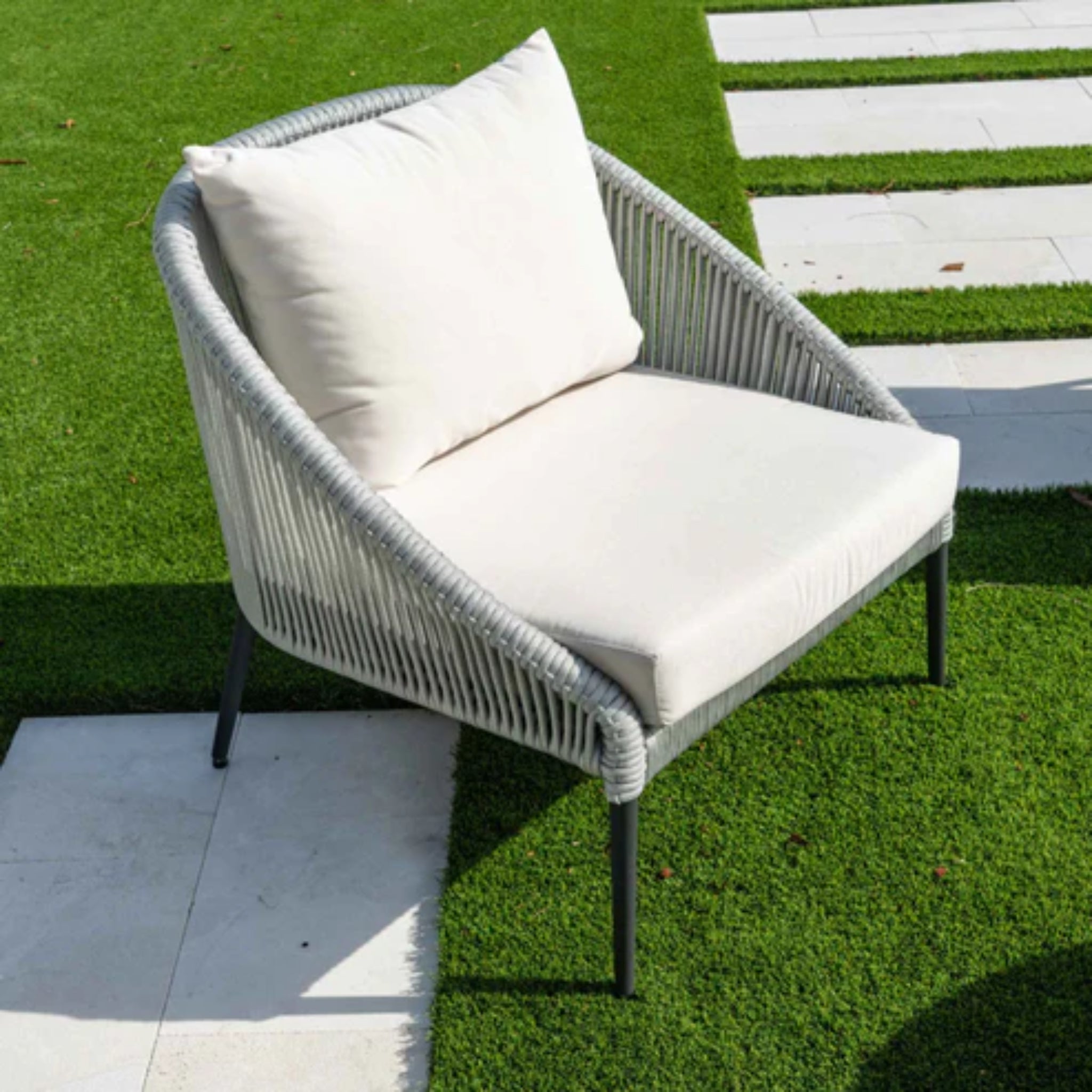 Skyline Design Rodona outdoor lounge chair in silver grey polyrope with armrests, suitable for patio or outdoor relaxation.