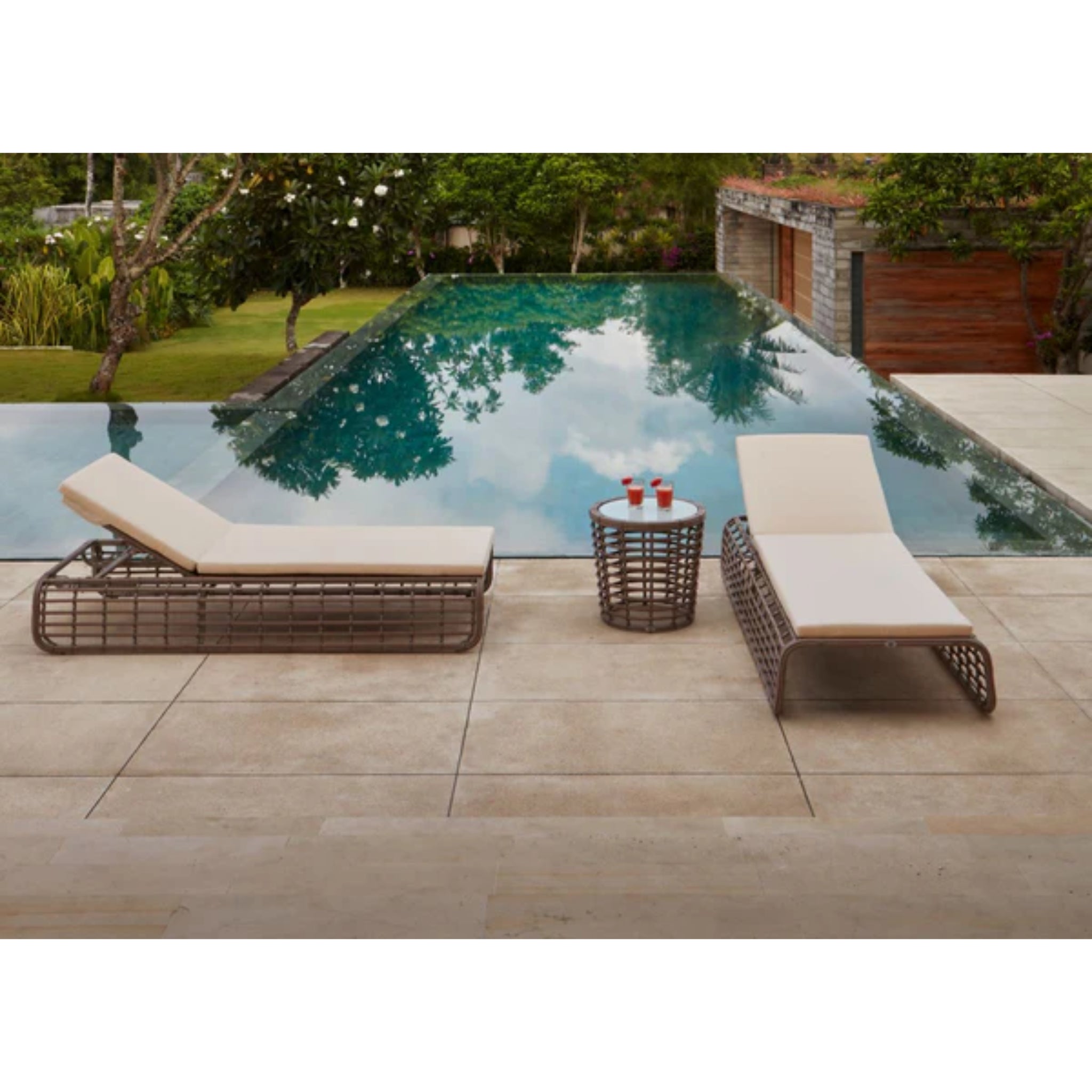 Skyline Design Ruby outdoor chaise lounge with mushroom woven fiber, poolside outdoor lounger for relaxing and sunbathing.